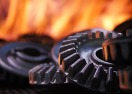 Ingranaggi metallici e fonte di calore